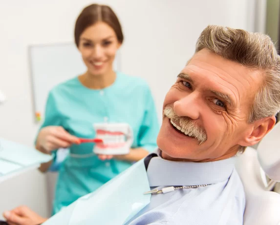 Man with dental implants smiling