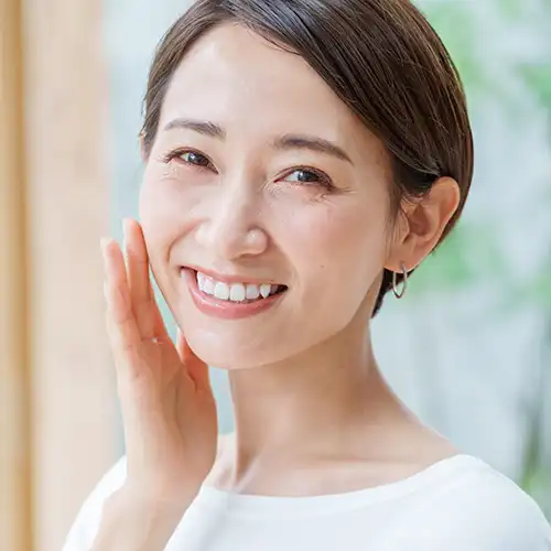 Woman smiling with dental implants