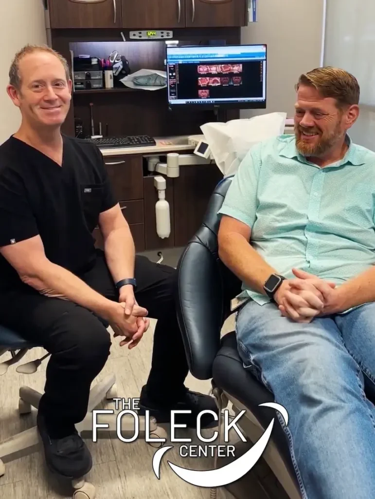 Happy Williamsburg patient smiling after successful dental implant treatment at Southeast Dental Implants by Dr. Foleck