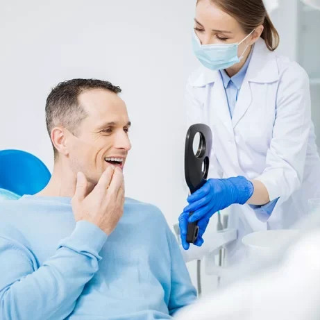 Man after tooth replacement dental implant